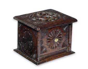 Foot Warmers - An 18th century carved oak foot warmer, Dutch/Scandinavian. Of square form, all-over carved with geometric motifs and with fan spandrels, the top board pierced with an endless knot, the front with slot-in door, lacking handle. Sold at Bonham's October 1, 2014 for $796.
