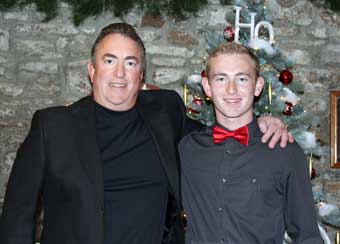 Brandywine River Antiques Market: Chadds Ford, PA - Michael McLimans standing by the Christmas tree with his son Hunter.
