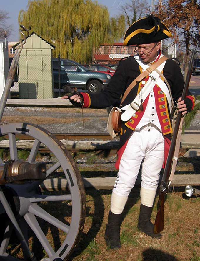 Salem, NJ Yuletide Tour - A Revolutionary War soldier demonstrating the use of a cannot at Johan Printz Memorial Park
